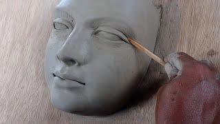 making a female face with water based clay//how to make a face with clay... sculpting face in clay