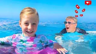 Nastya and dad play hide and seek in a huge pool - Video series for kids