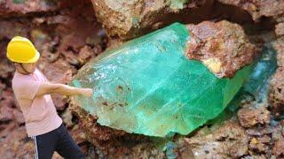Diamonds and emeralds emerge from crevices in rocks after torrential rain