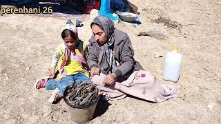 Motherless children: Soghra and her brother and sister in the heart of the mountain, digging a cave