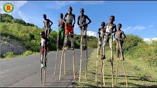 BANNA BOYS WALKING ON STILTS