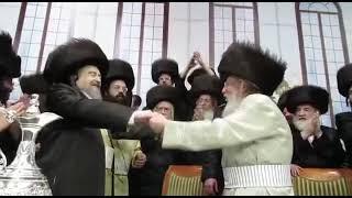 Rav Yaakov Meir Schechter graces the tish of the Pinsk-Karlin Rebbe with his presence