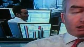 Banker caught on TV looking at Miranda Kerr pics instead of charts