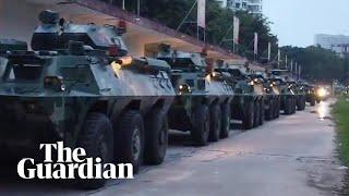 China releases video showing troop carriers moving to Hong Kong border