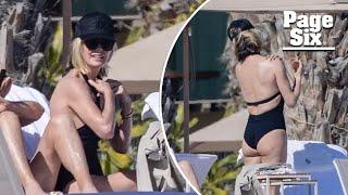 Charlize Theron, 49, soaks up the sun in a black swimsuit on family vacation to Mexico