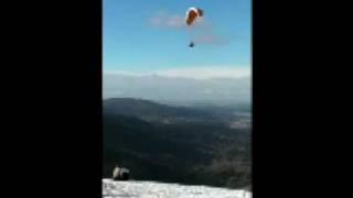 Paraglider landing on Poo Poo Point