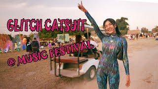 Beautiful Asian Model On Music Festival in Shiny Glitch Catsuit