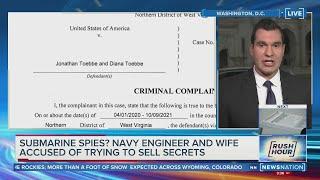 Couple in submarine spy case to remain held; hearing set