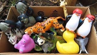 Box filled with various Zoo Animal Toys  