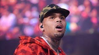 Chris Brown in custody in Paris on rape allegations