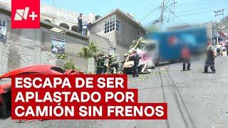 Salta de su auto y se salva de ser aplastado por un camión sin frenos - N+