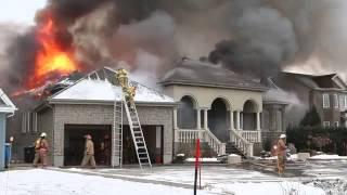 Firefighters fall off ladder at house fire.