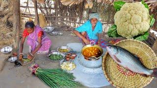 Cauliflower and Rohu Fish curry and onion leaves fry cooking by santali tribe ol couple for lunch