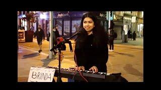 Lady dancing away to Blinding lights - the Weeknd live cover on Grafton street by Brinda Irani