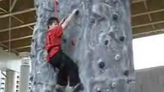 Connor conquers climbing wall (eventualy)