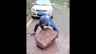 making the road saver by removing giant rocks