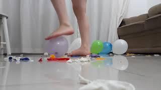 Bare Feet Squeezes and Crush Colorful Balloons