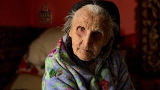 Severe old age of a 96 year old grandmother with her son in a high mountain village