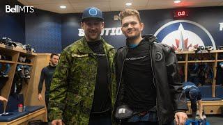 Cole Perfetti finally smiles after receiving Player of the Game jacket