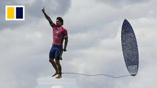 Why is the Paris Olympics surfing event being held in Tahiti?