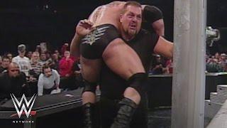 WWE Network: Big Show chokeslams Brock Lesnar through the announce table: SmackDown, Oct. 31, 2002