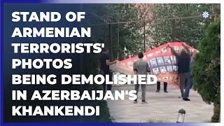 Stand of Armenian terrorists' photos being demolished in Azerbaijan's Khankendi