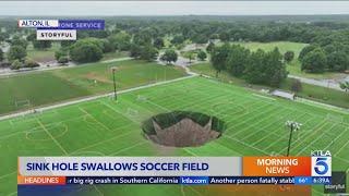 Massive sinkhole swallows soccer fields, light pole
