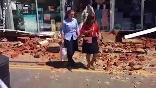 Shoppers forced to flee as bricks from building collapse