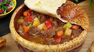 Meat pottery the most impressive dish  with bread and salad