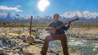 Playing Gourd Banjo during the partial Solar Eclipse