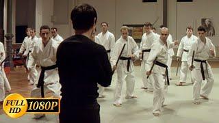 Jet Li versus two dozen karate guys with sticks in a police station / Kiss of the Dragon (2001)