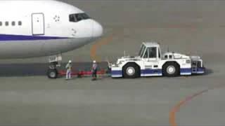 pushing back an ANA B767-300 at Haneda Airport