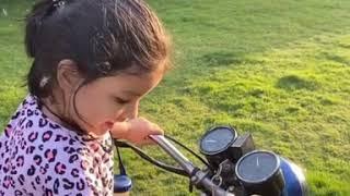 Ziva Dhoni on a bike as papa Dhoni makes a 'handy' cameo