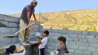 Master Mustafa built her wall house with the help of her children