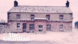 Ireland: white sea foam blankets village of Bunmahon in County Waterford