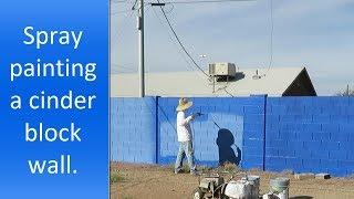 Spray painting cinder block walls step by step.