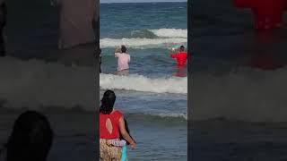 Partivlingam pandits and yagman taking it in the ocean