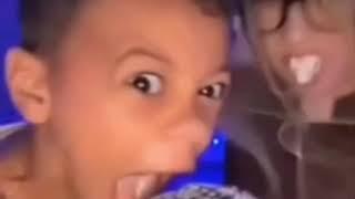 a kid screams into the microphone violently
