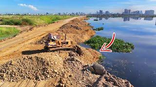 Amazing Komatsu Bulldozer Pushing Stones To Repair A Long Road On The Water