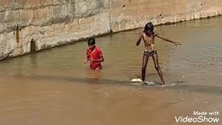 A village girl showing her stunt in the river