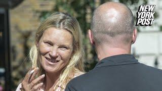 Kate Moss looks unrecognizable while smoking a cigarette during family lunch