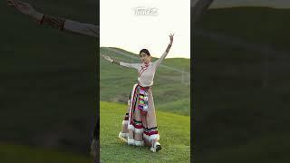 The Tibetan girl dances in the sunlight