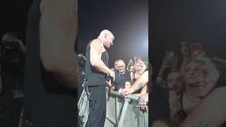 Disturbed stops show to comfort scared girl