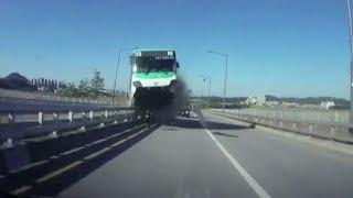 Korean bus crashes into bridge barrier