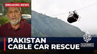 Pakistan army rushes to rescue children trapped in cable car over ravine