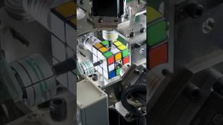 Fastest time for a robot to solve a rotating puzzle cube - 0.305 seconds by Mitsubishi Electric 