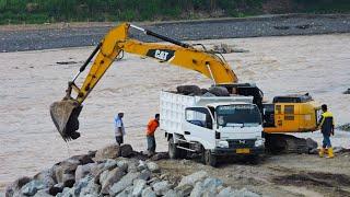 CAT 336 Excavator Dump Truck continuously Making Piles of Rocks