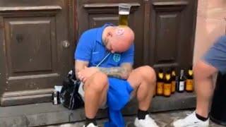 England fans balance beer on sleeping man's head