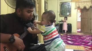 Triplets enjoying guitar