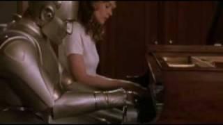 Bicentennial Man: Little Miss teaches Andrew how to play the piano.